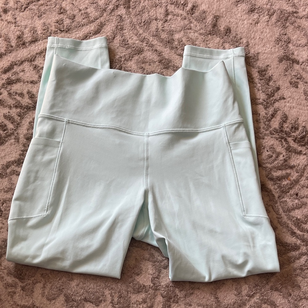 Athleta Salutation Stash Pocket II 7/8 mint Aqua High-Waisted Leggings size med